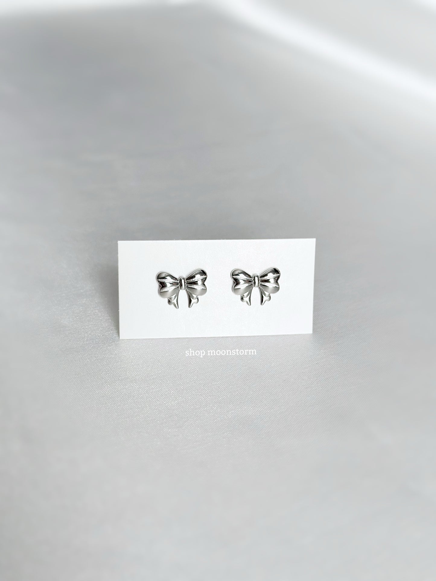 Lux Ribbon Bow Stud Earrings (Silver Version)